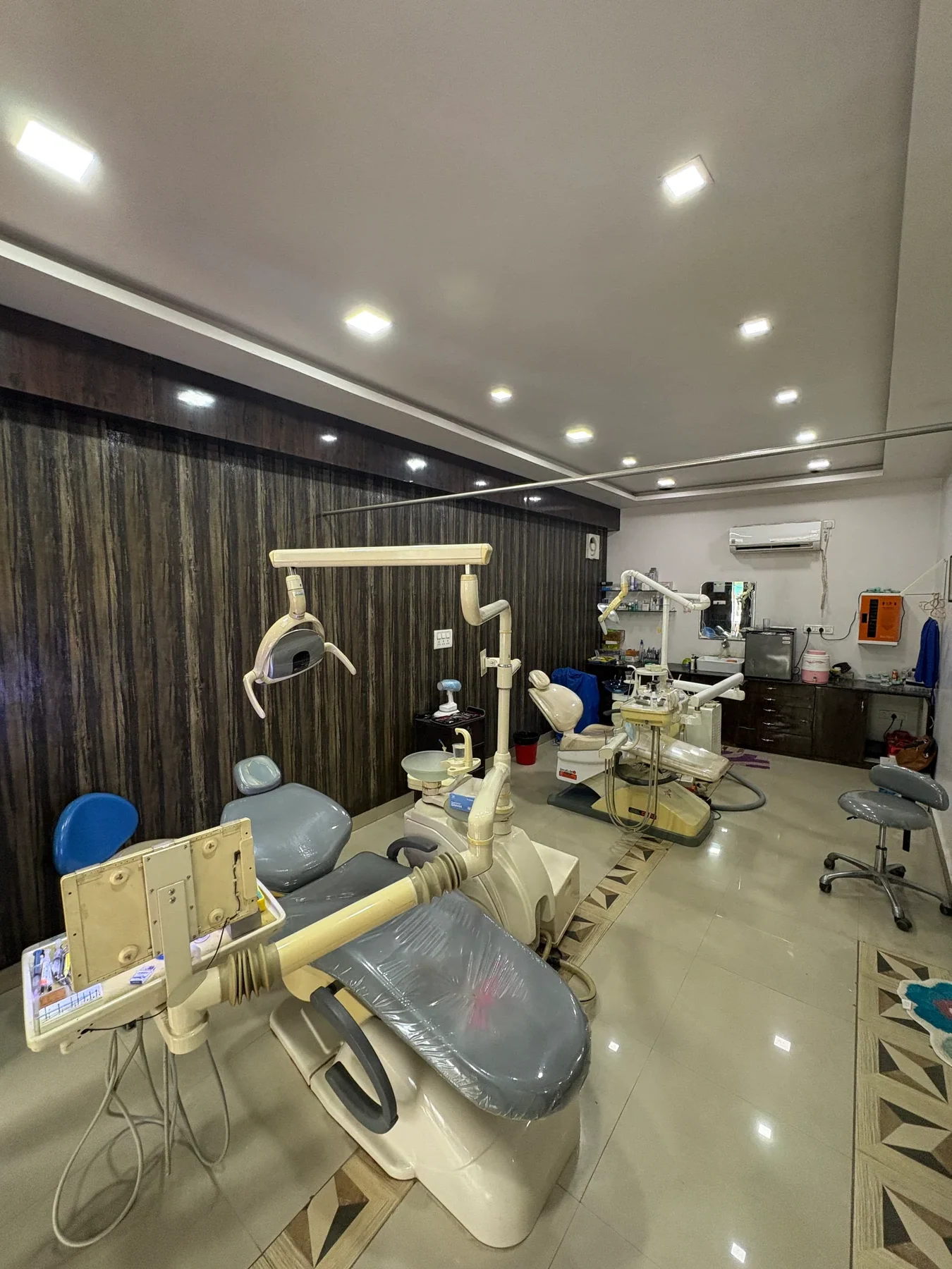 Wide view of Oro Care dental treatment room with dental chairs and clinical equipment